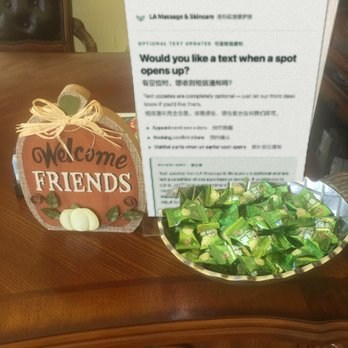 Opt-in sign displayed at the LA Massage & Skincare front desk